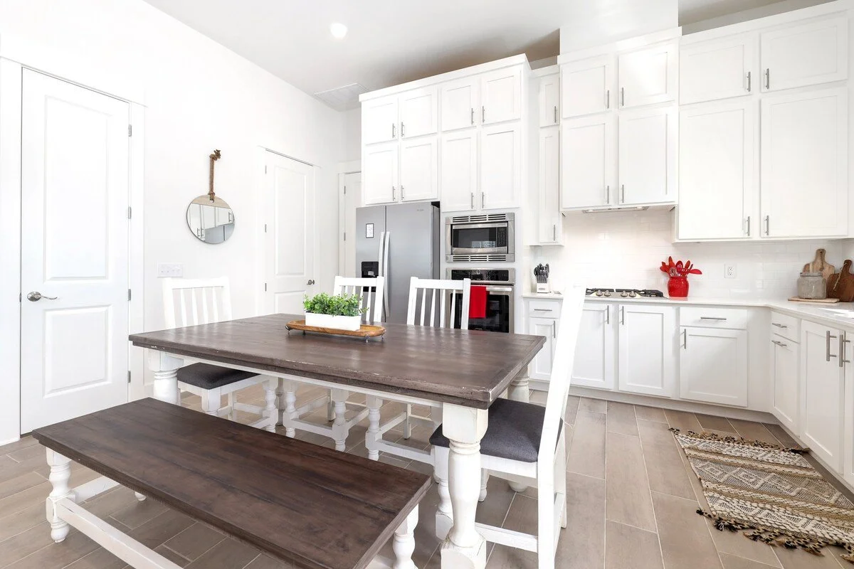 Directly behind the living room, you'll see our 6-top dining table. This cozy space is perfect for communal dining, great conversation and board games with your crew. 