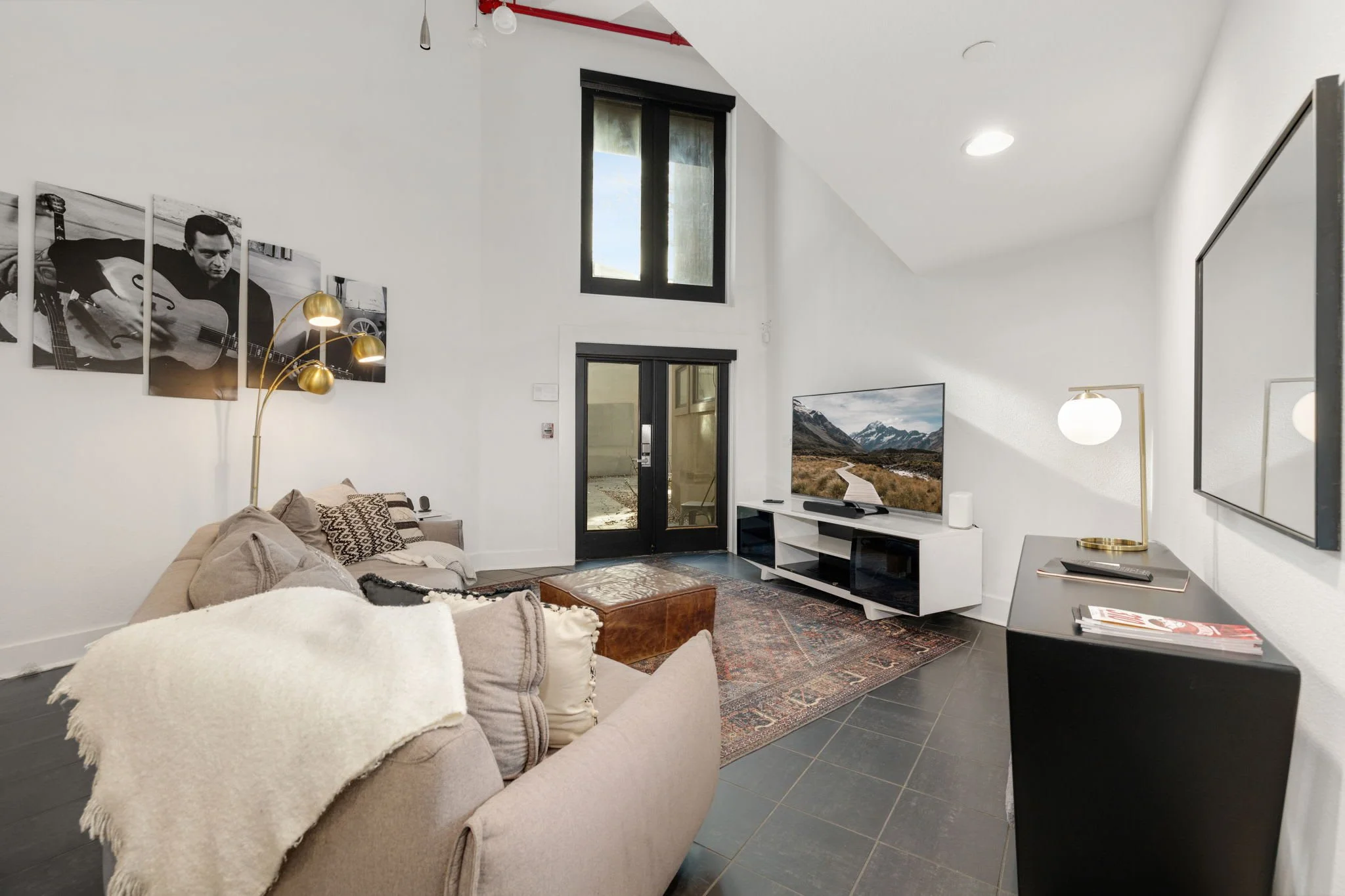 a contemporary two-story great room that embraces open concept living.