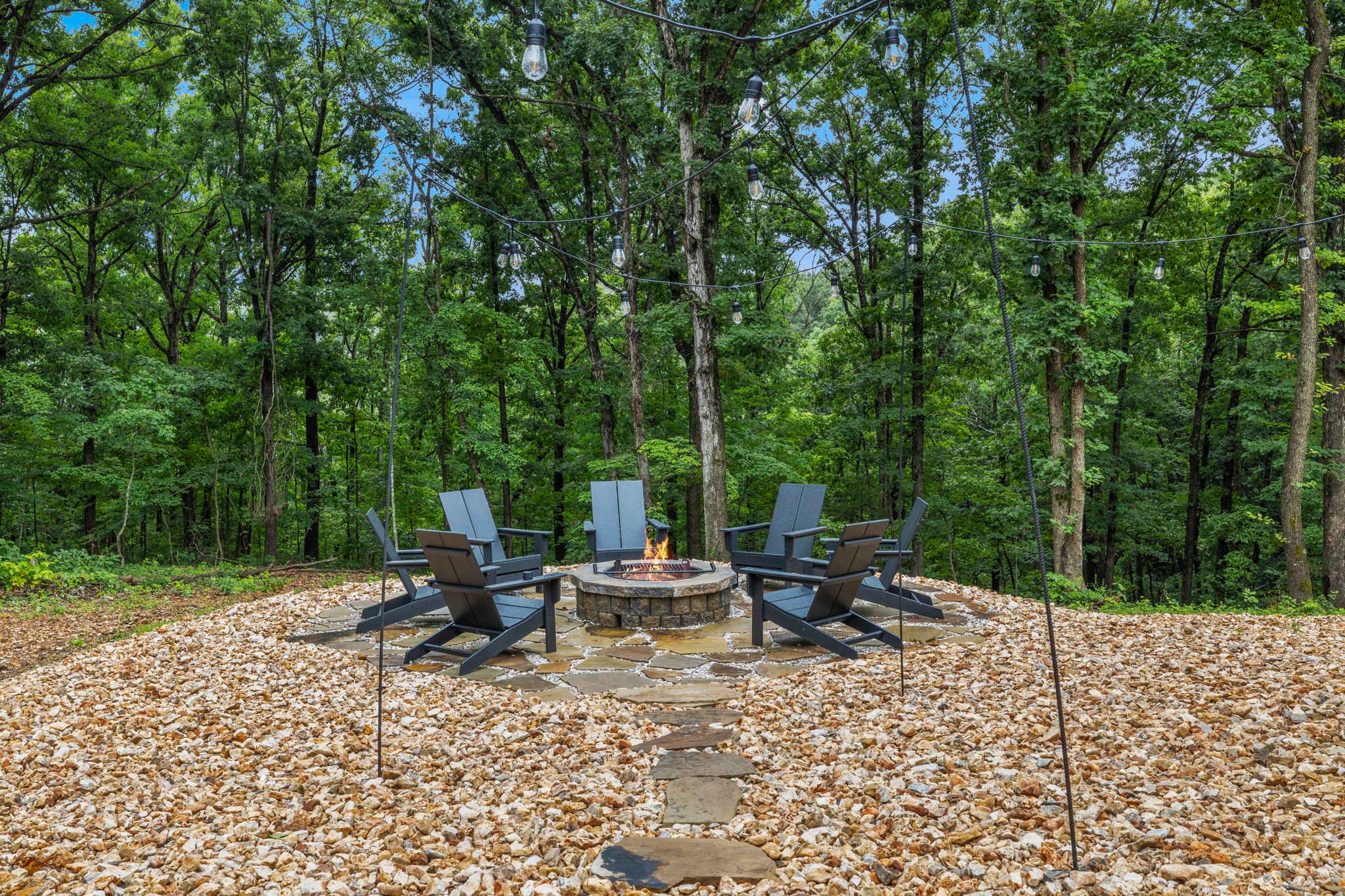 Roast s'mores over the campfire around the fire pit.