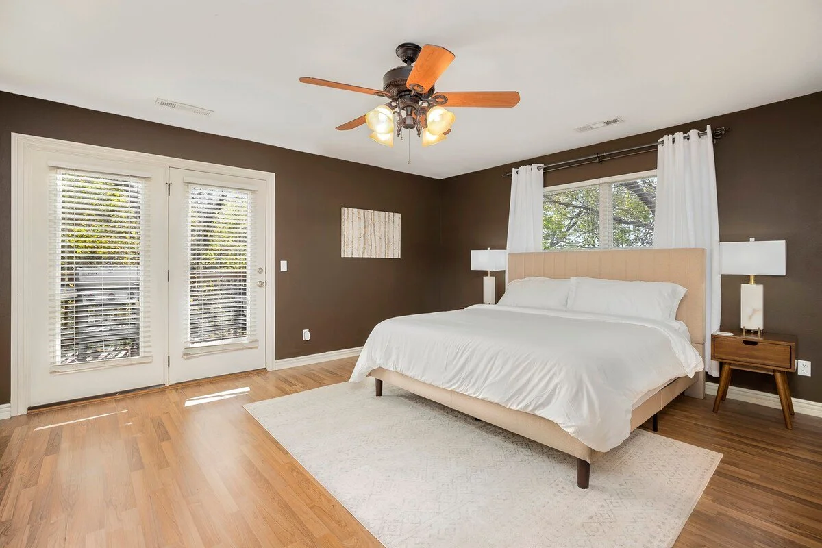The main level of our home features three bedrooms. A King bedroom with freshly remodeled luxury en suite bath plus patio views. The other two bedrooms on the main level are private Queen rooms.