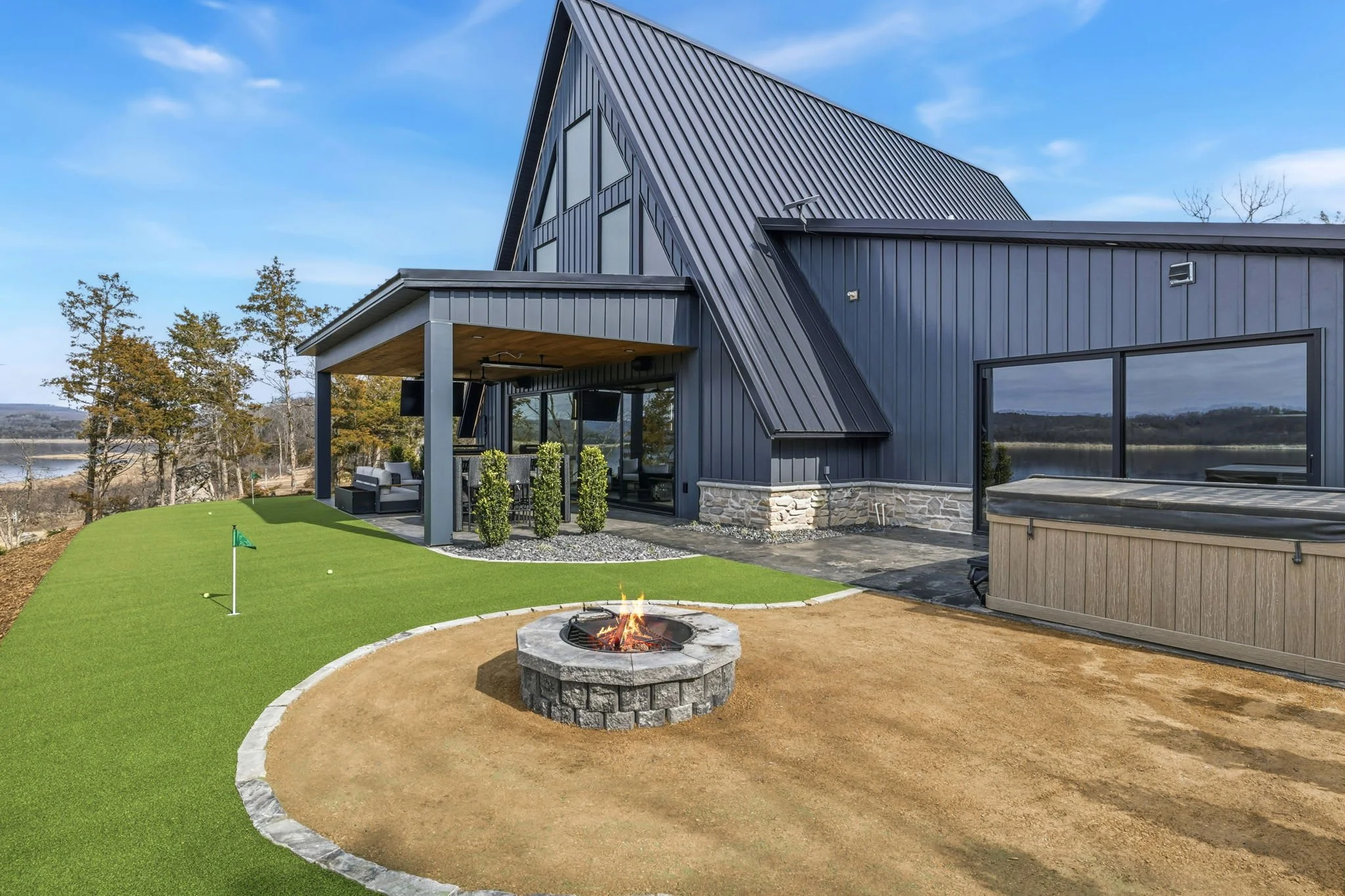 Putting green, fire pit & large hot tub! — Outdoor shower is available in the Summer.
