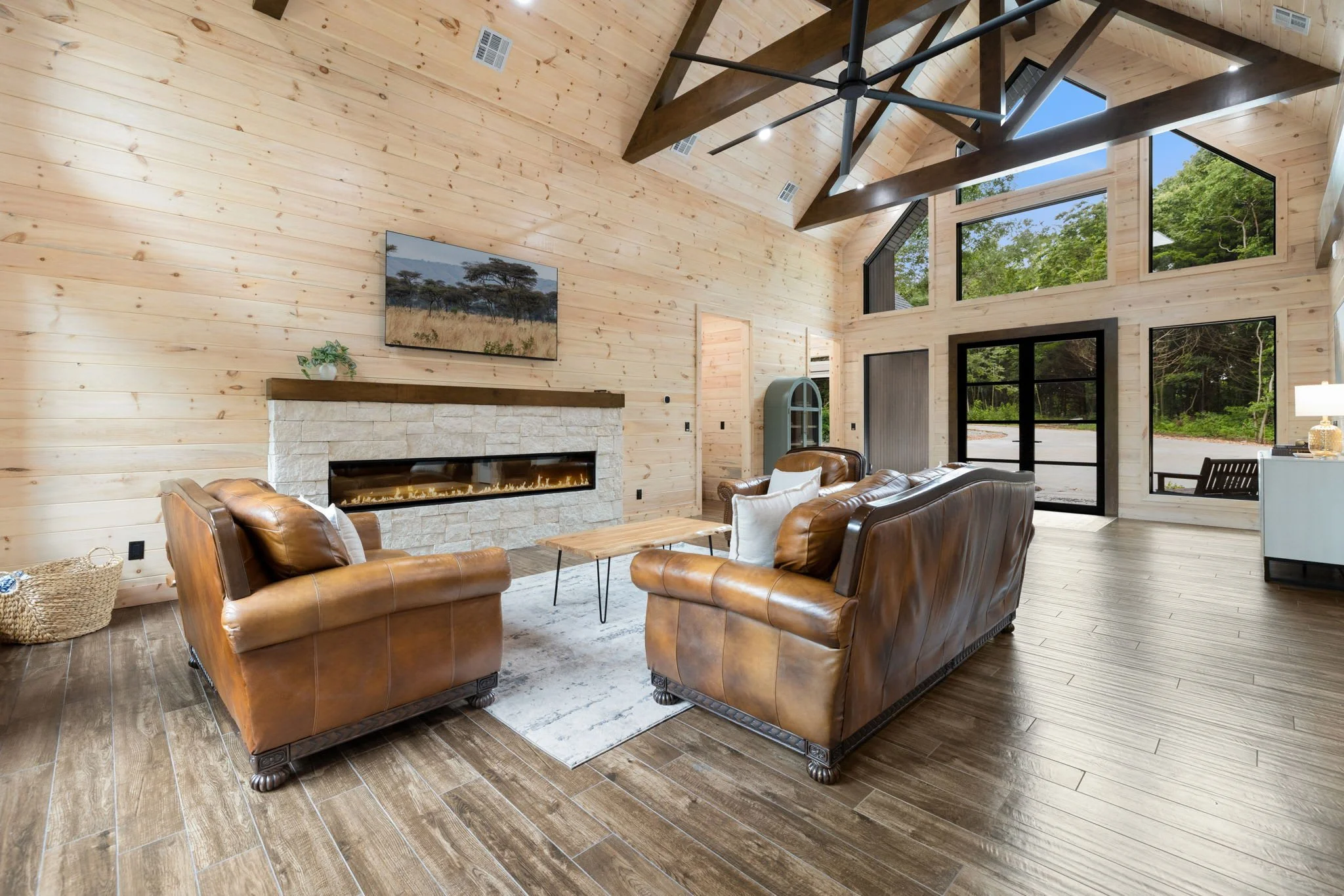 The living room has seating, a Smart TV and fireplace.