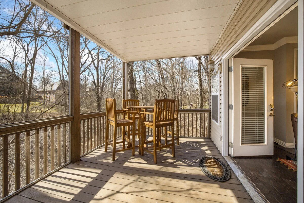 The lowest level of our home features a screened-in porch and a seating area, perfect for late-night kickbacks. 