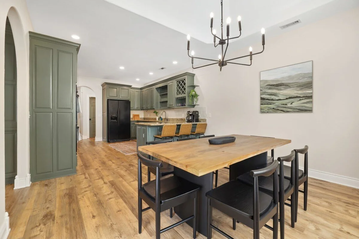 Just off the kitchen, you'll find our eight-top dining table, perfect for enjoying a home-cooked meal or local takeout!