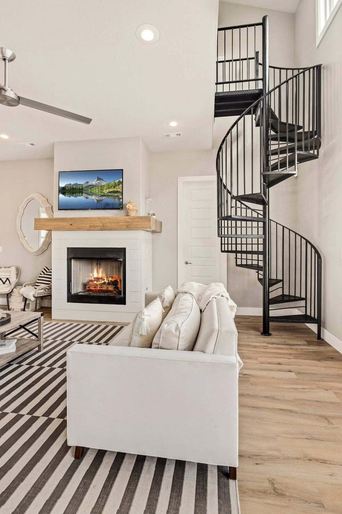 A spiral staircase from the main living room to the top floor (which feels like an oversized loft).
