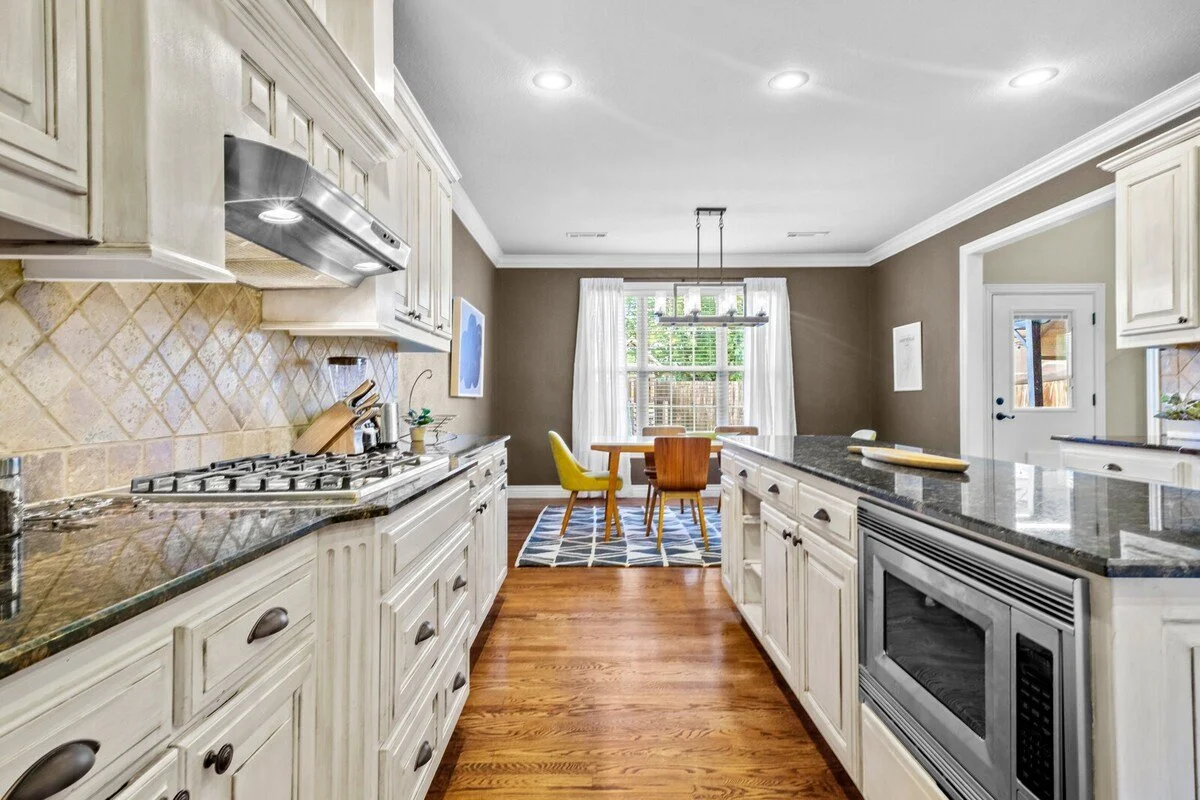 Off the living room, you'll find a fully stocked kitchen, featuring a Smart refrigerator plus all the necessary amenities for cooking, baking and making that perfect cup of coffee.