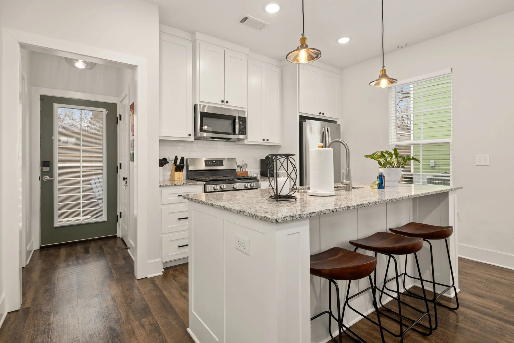 Fully stocked kitchen with high-end amenities, cookware and supplies.