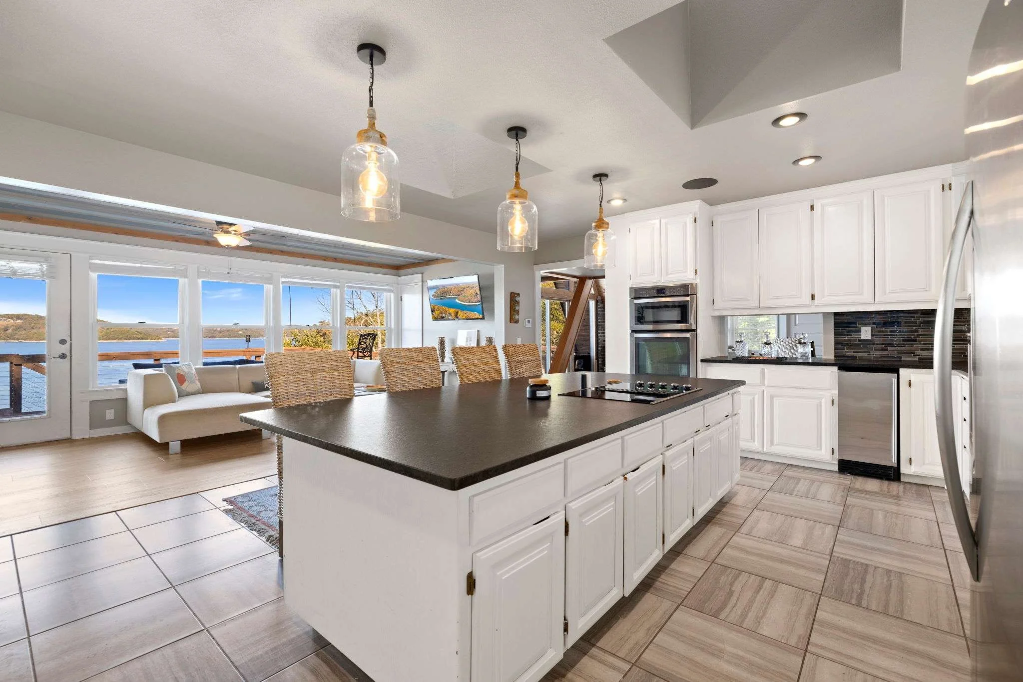 This entire space is flooded with natural light and boasts gorgeous views of Beaver Lake from every angle. 