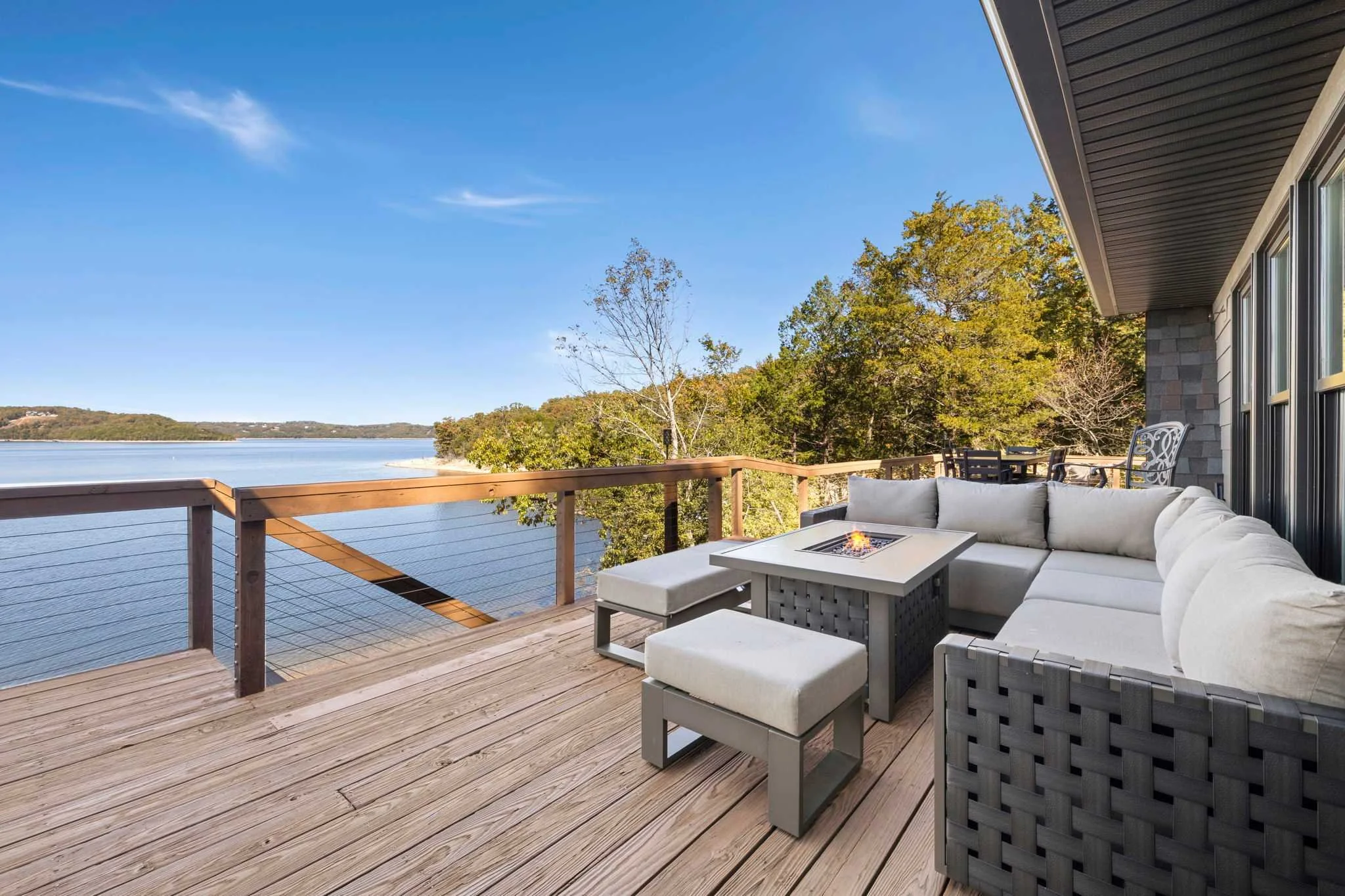 Lounge seating with fire pit for cozy evenings on the deck.