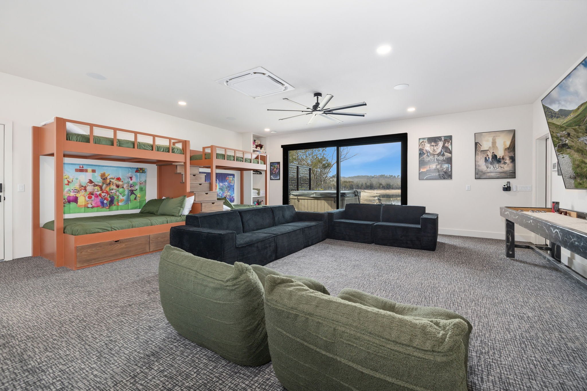 This space also has built in bunk beds and access to the patio!