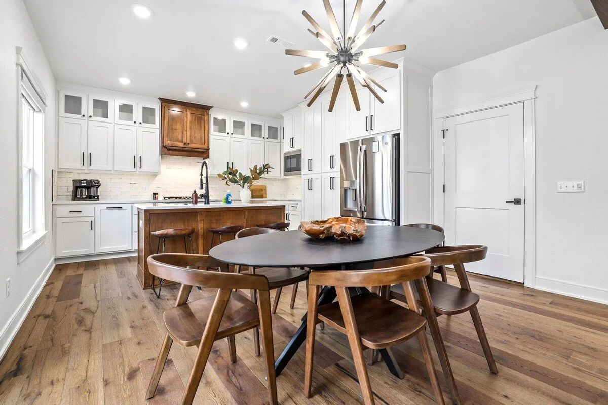 In between the living room and kitchen area, you'll see our oval, 6-top dining table - the perfect place to enjoy a meal and conversation with the crew. 