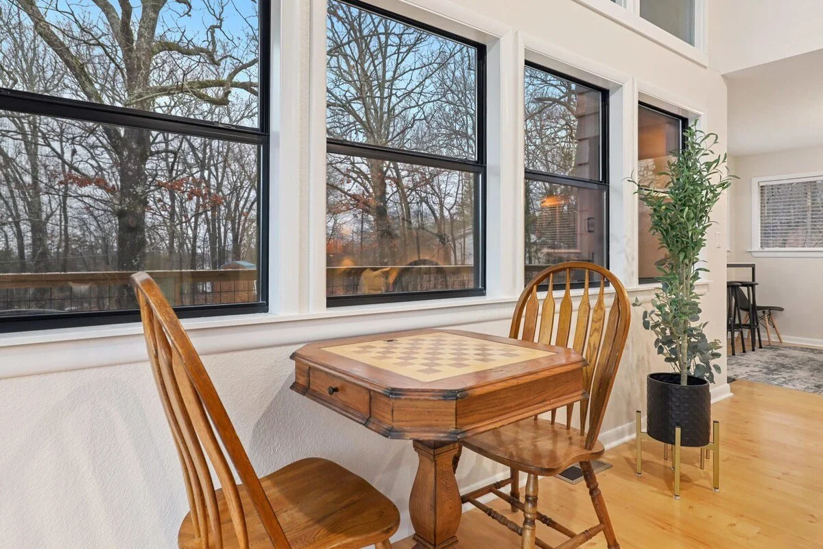 The Woodland has plenty of natural light throughout. — Enjoy a game of chess at our checkerboard table with an amazing view.