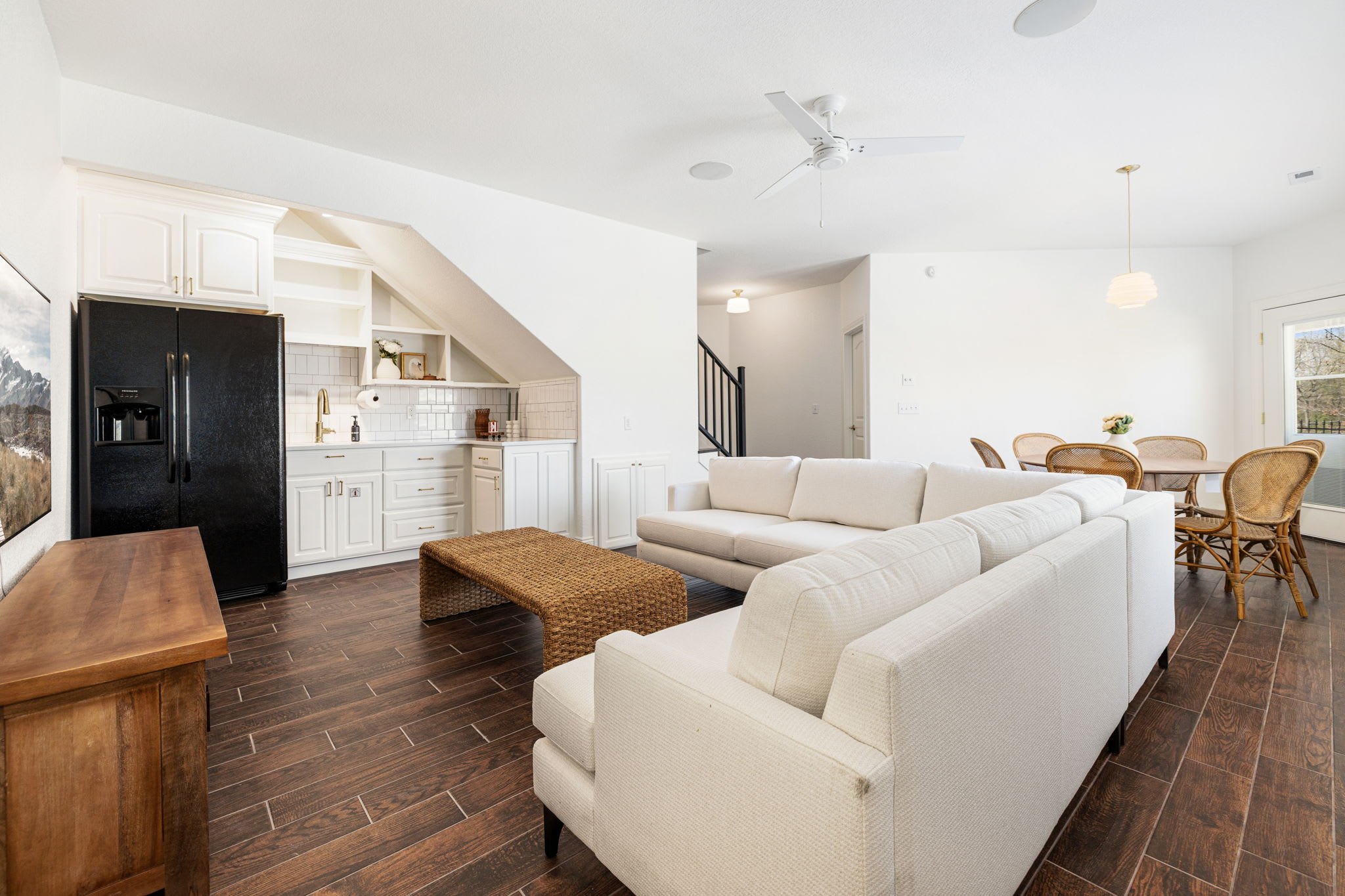 Downstairs is our game room! Enjoy another living space, large Smart TV with Sonos sound system, seating, and kitchenette. 