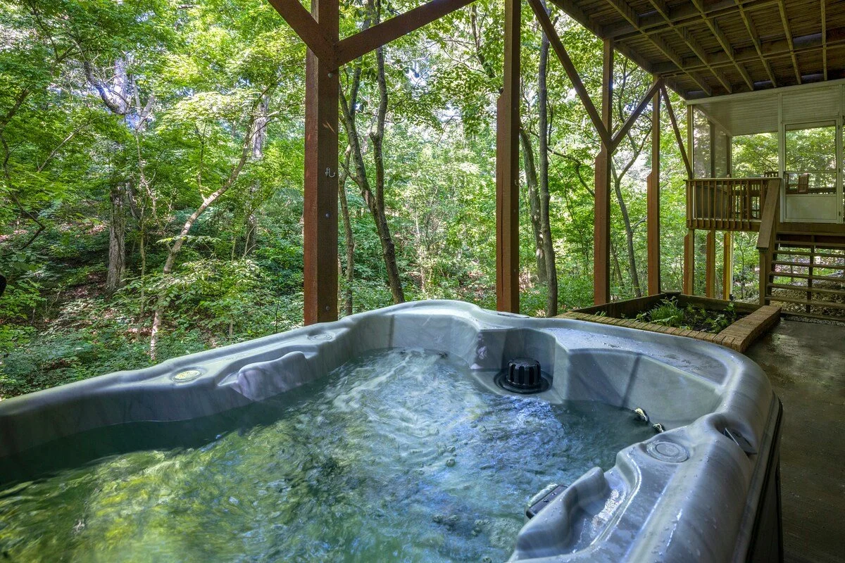 Step down from the screened-in porch to find our private hot tub! 