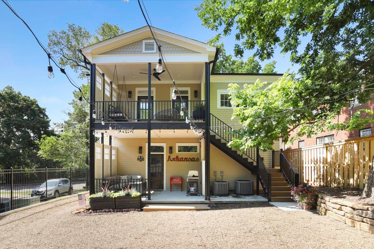 The upper patio has access to the backyard and parking.