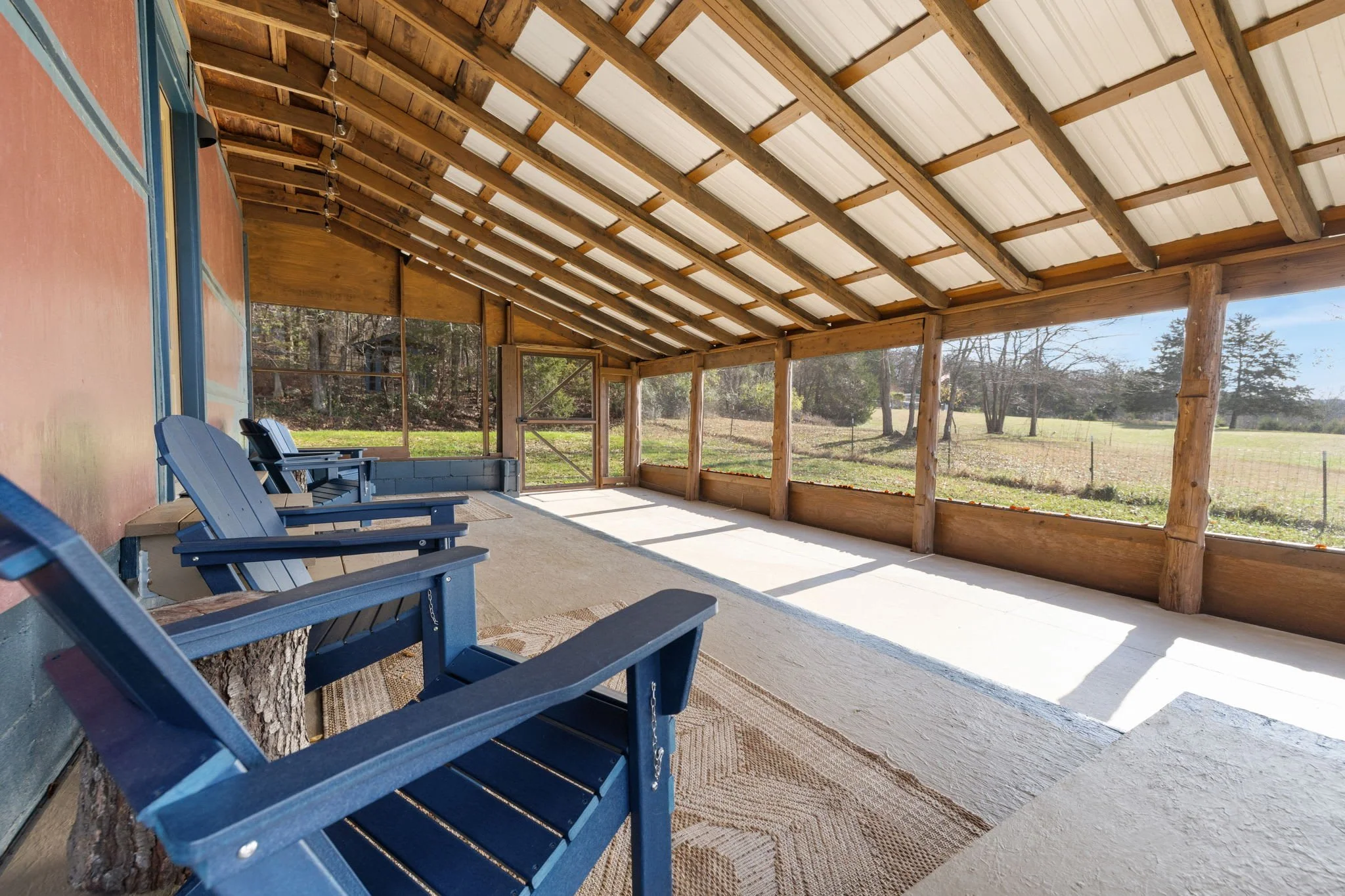 The best hangout spot is the huge screened-in porch looking out into the woods! 
