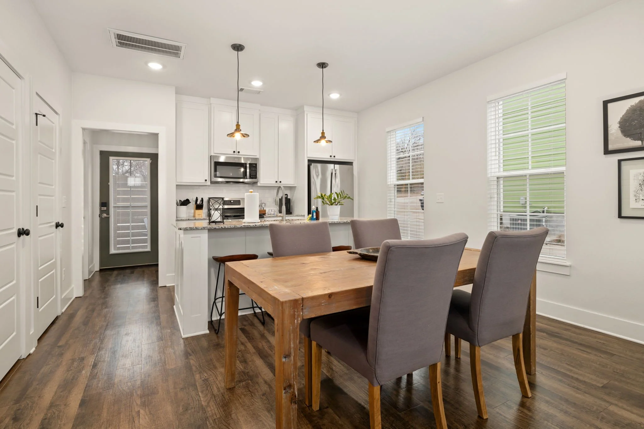 Dining table for 4 and barstool seating.
