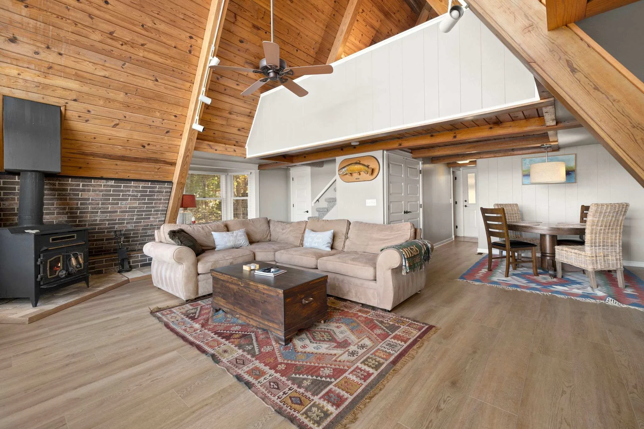 Access the loft from the stairs behind the sofa.