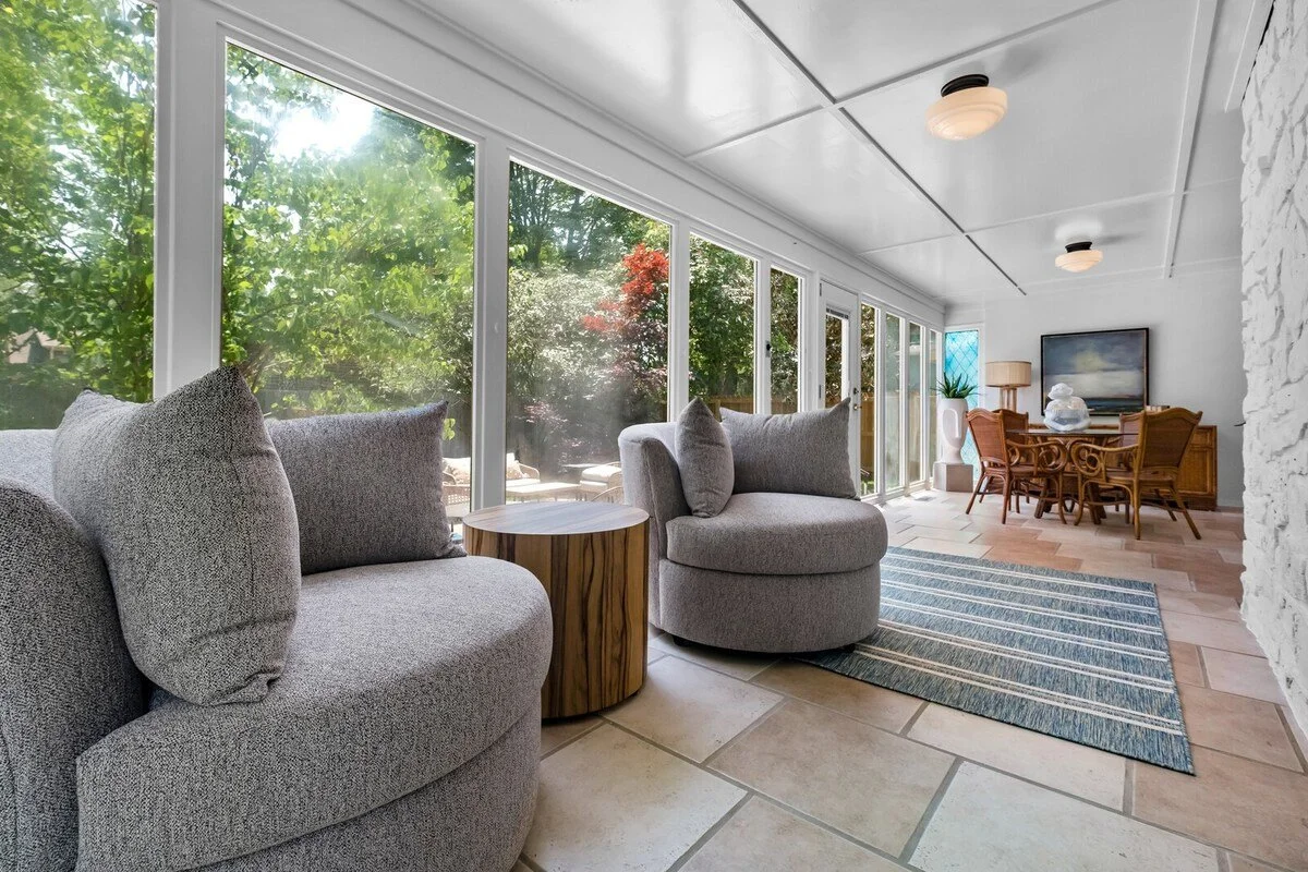 Past the living room, you'll see a door leading into our Sun Room. 