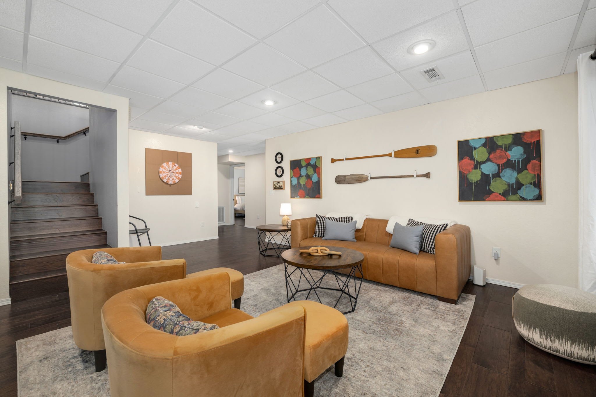 Downstairs, there is an additional living space with more seating.