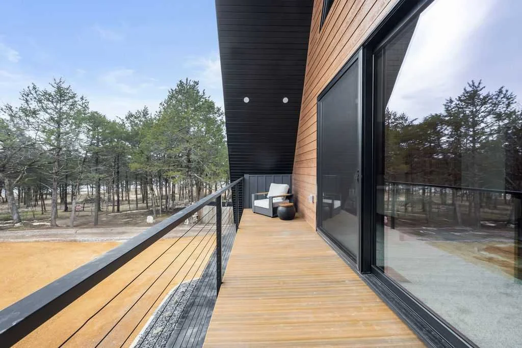 The balcony is a perfect spot to escape with a book and a cool drink.
