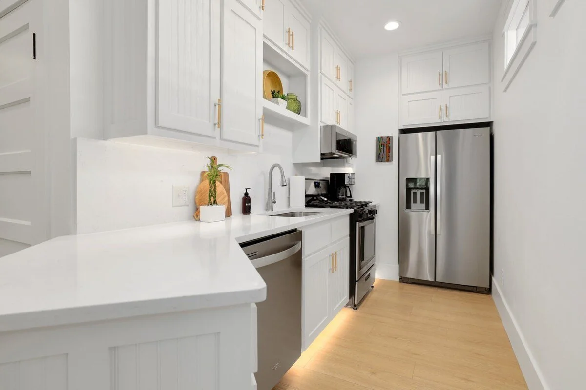 Plus, a fully stocked kitchen, complete with new Whirlpool appliances and dining essentials.