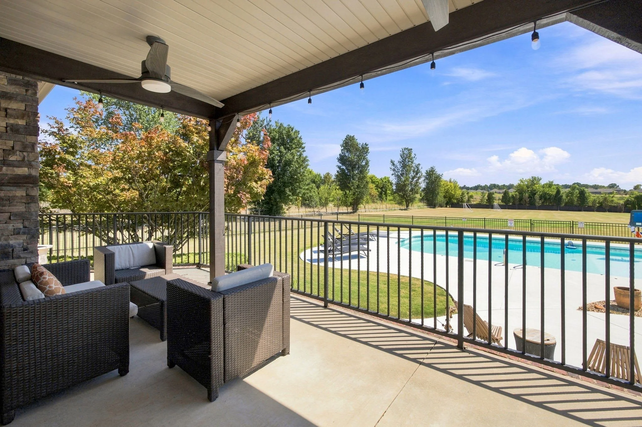 The patio overlooks Mt. Hebron Park, the backyard, and the pool.