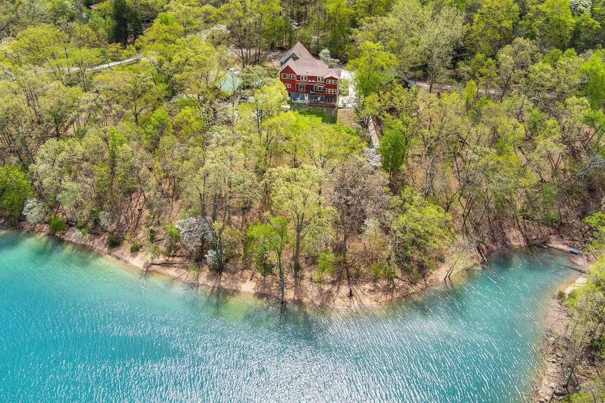 Perched above the banks of Beaver Lake, you will find a perfect retreat with ample outdoor living and sweeping views.
