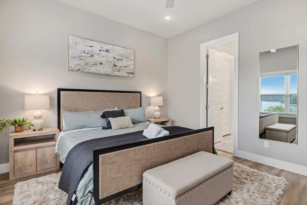 The master bedroom is on the main level of our home and has a 65-inch Smart TV, King sized memory foam mattress (Nolah brand) and an en suite bathroom. The other two private bedrooms feature Queen beds and are downstairs and share a large bathroom. 