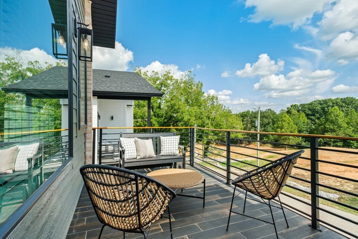 Through the game room, find our balcony complete with a porch glider and conversational seating. The perfect place to unwind and enjoy views of Bentonville from above!
