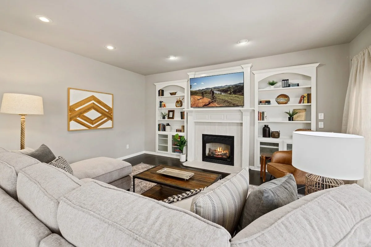 The main living room is centered around a gas fireplace. Enjoy your favorite shows or movies on our 70-inch Smart TV. 
