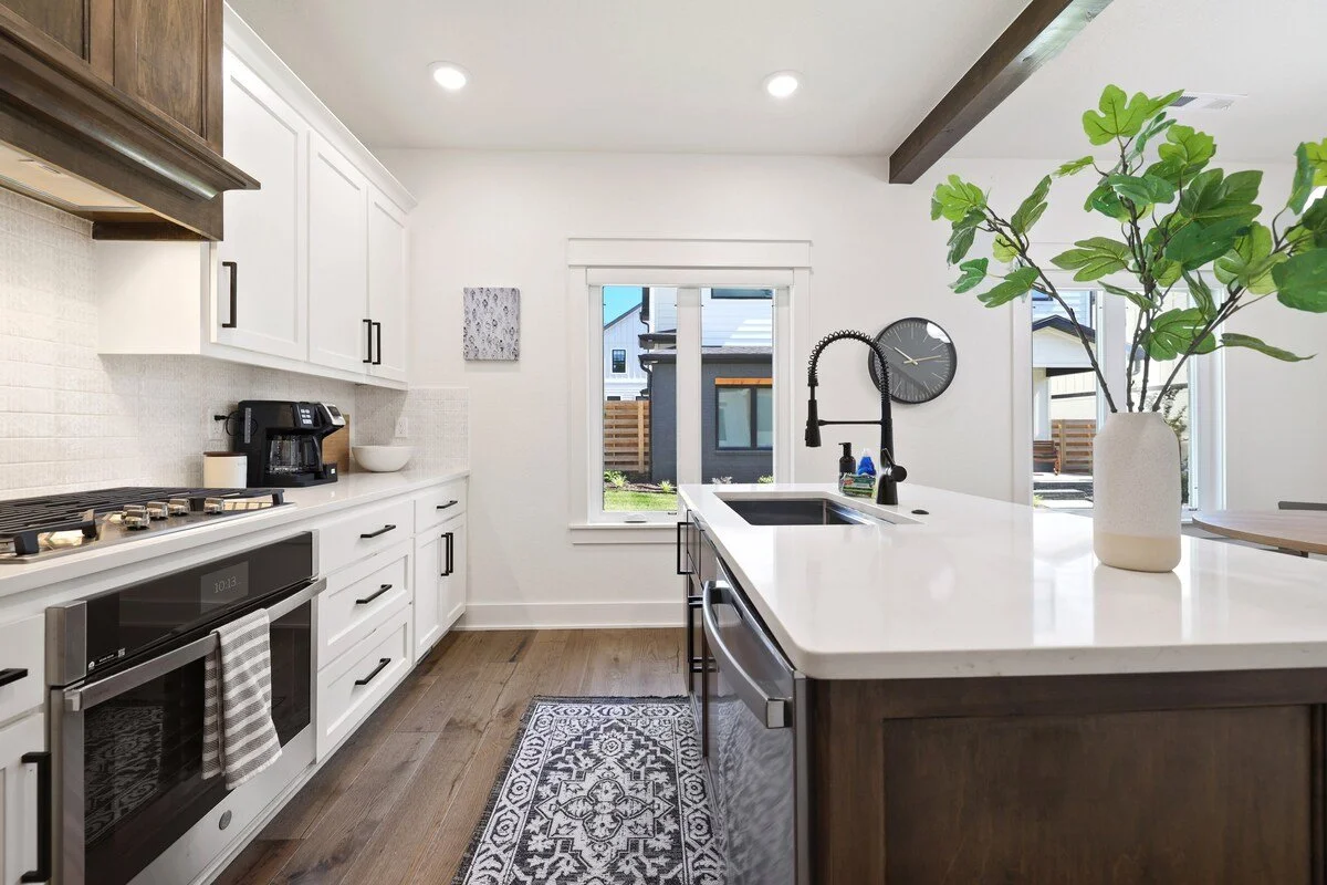 Past the dining area, you'll see our kitchen, which is fully stocked with state-of-the-art amenities and appliances, including a gas stove, combination Keurig/drip coffee pot and plenty of built-in storage. 