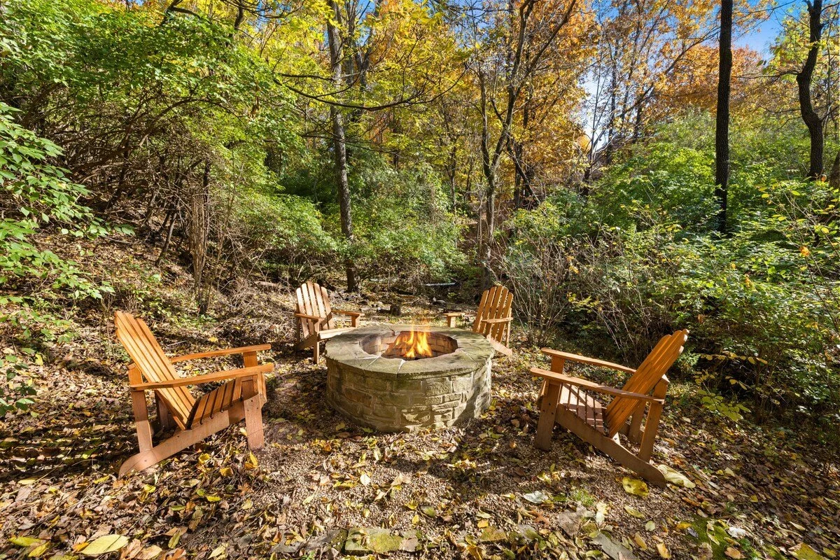 Through the door in our ground floor kitchen and living area, you’ll have access to our large, fenced in backyard, which features a fire pit and four chairs for your enjoyment. 