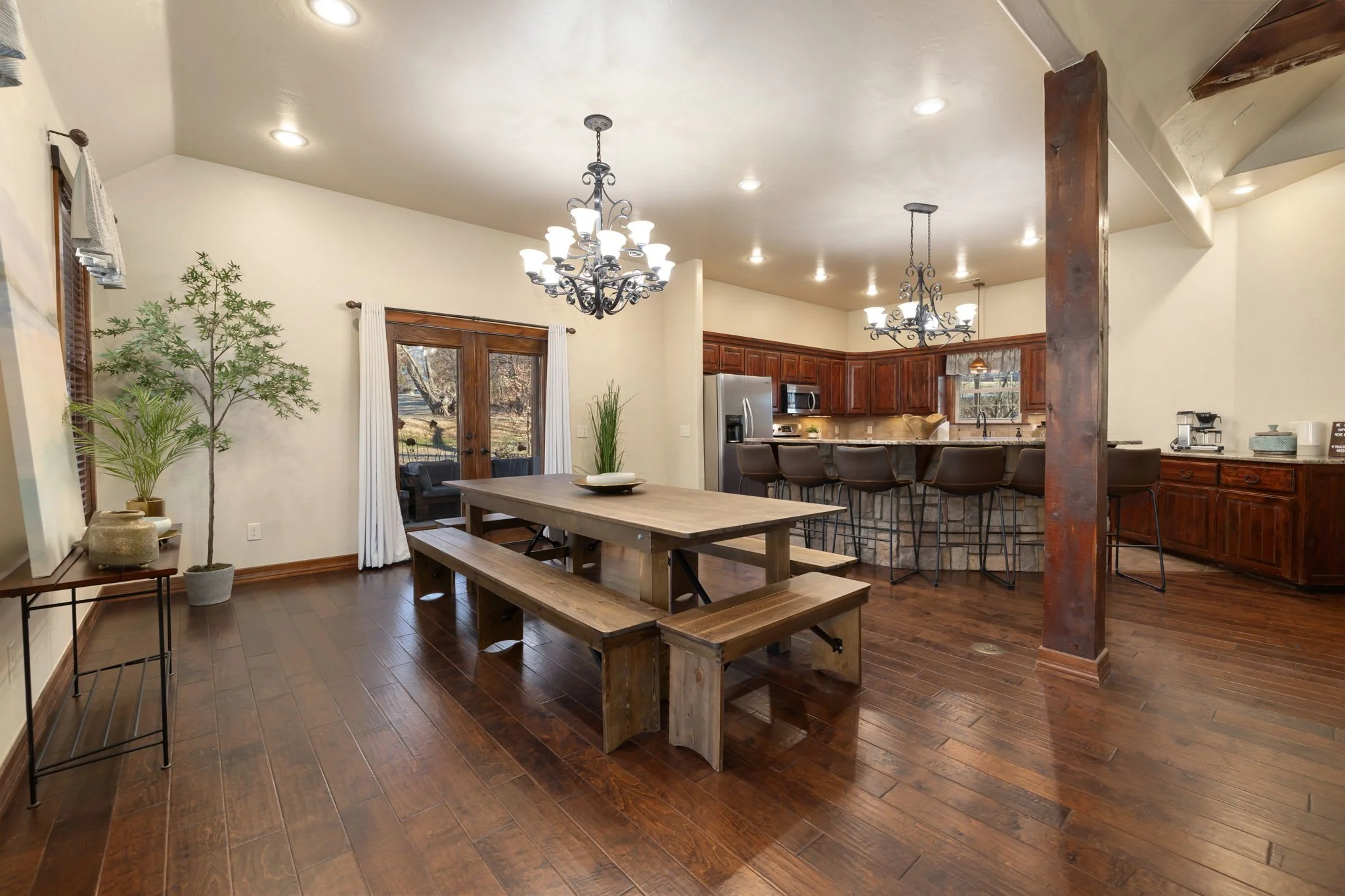 Large, elegant dining table and access to the patios.