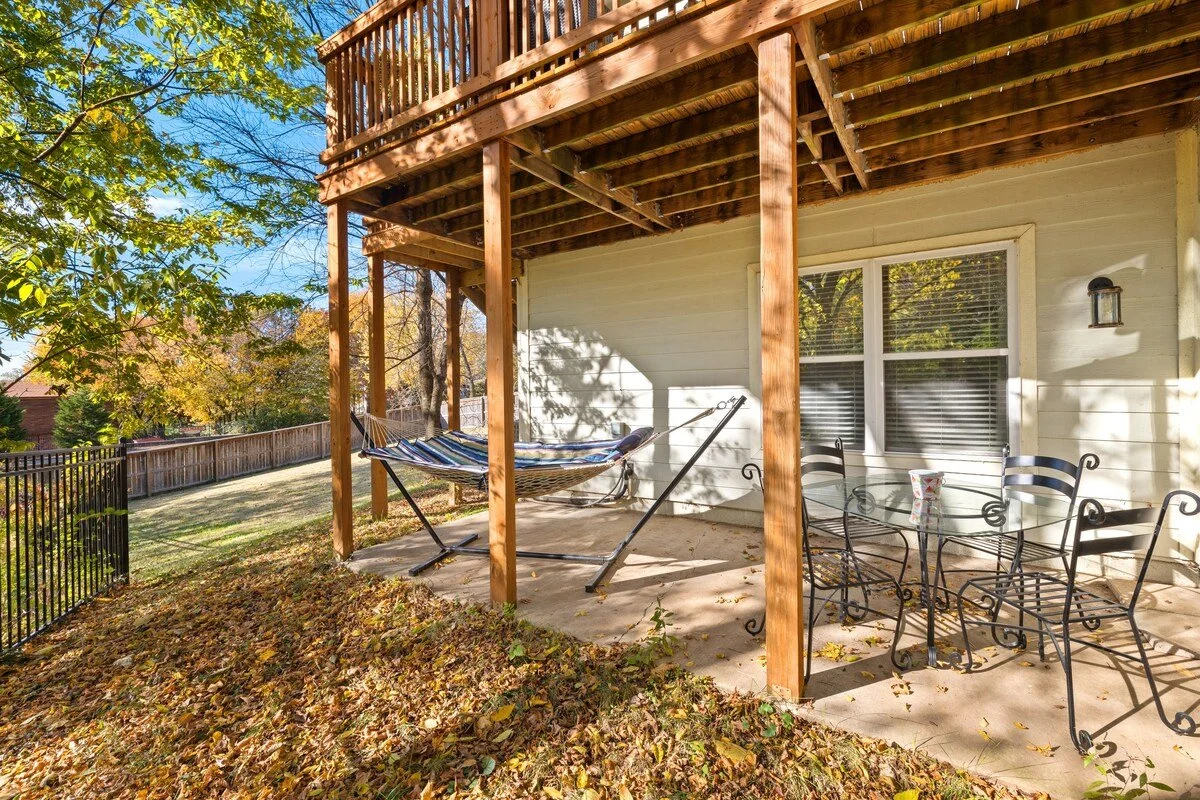 Our deck with an outdoor dining area and hammock can be accessed through the ground floor dining room or living.