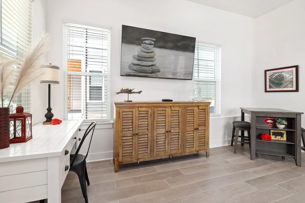 Movie nights are all set with this 70-inch Vizio Smart TV.  To the right, you'll see our butcher block island with two barstools. 