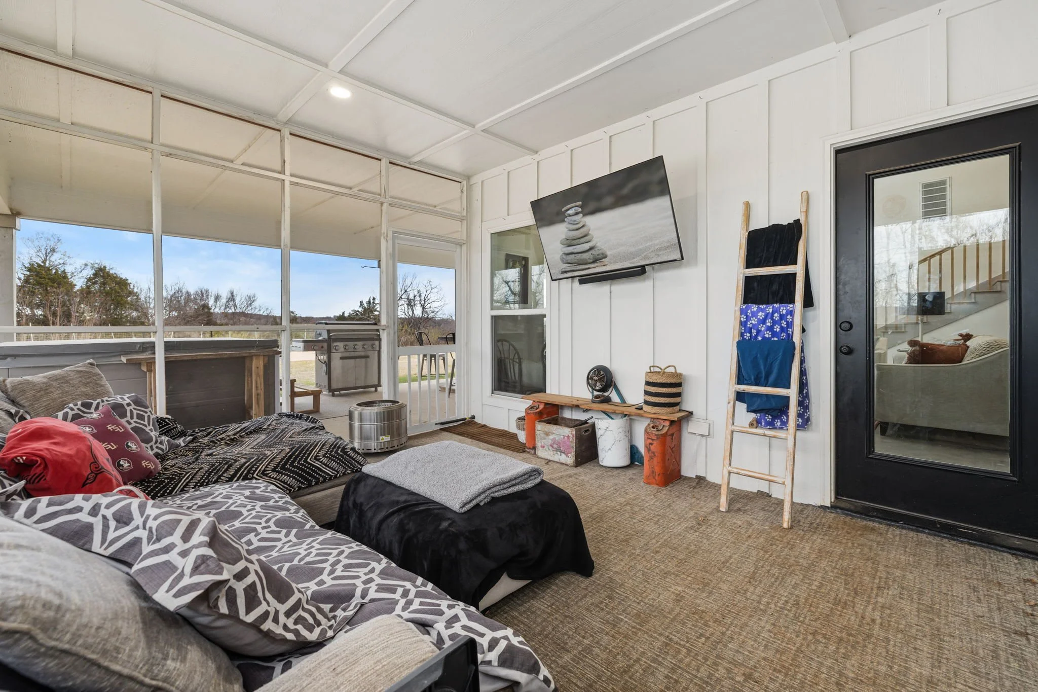 Just to the right of the living room space is our screened in porch. Curl up on our cozy sofa and catch your favorite show on the Smart TV. There are plenty of blankets to keep you warm on chilly evenings!