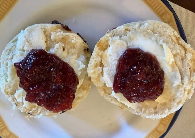 Scone with clotted cream and strawberry jam.
