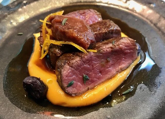 Venison, sweet potato puree, juniper jus, quince compote, preserved blueberries.  Amazingly good!