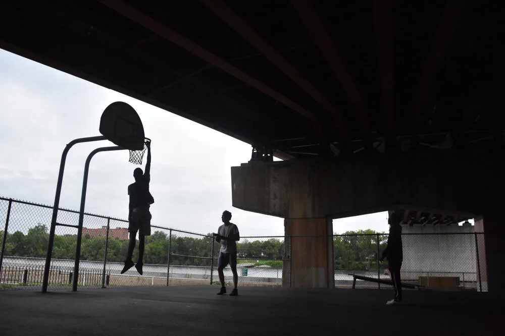  From left, Jarelle Summers, Patrick Quinn and Donovan Wooten play a game of pick up basketball in Troy, NY on Aug. 1, 2018. 