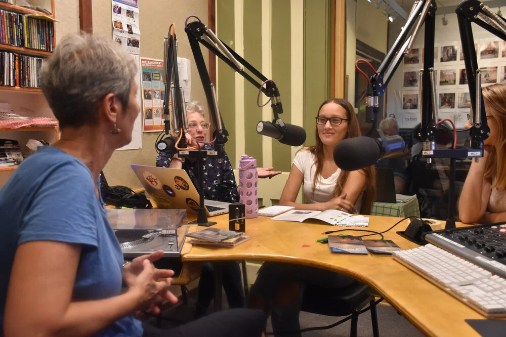  Mentor Kathy High, left, youth employee Felicia McConnell, center, and intern Julia Cavicci, right, speak in a round table discussion at the Sanctuary’s radio studio, WOOC 105.3 FM, in Troy, N.Y. on Aug. 8, 2018. McConnell produced a radio story abo