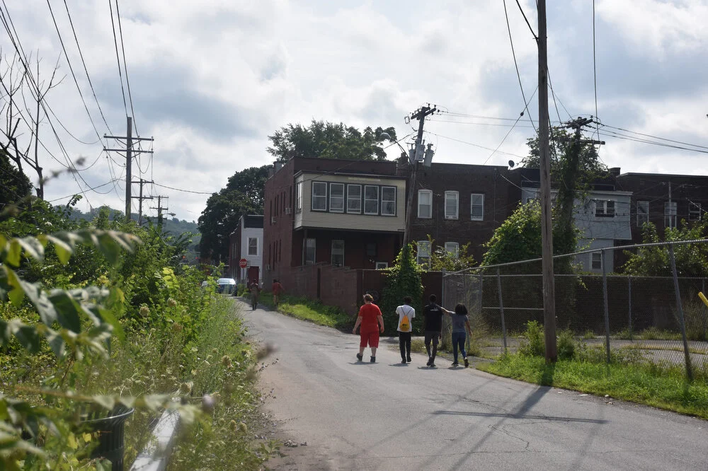  Uptown Summer youth employees Dakota Murray, Donovan Wooten, Jarelle Summers and Nicolena Russell take a walk down a side street in Troy, N.Y. on Aug. 8, 2018. 