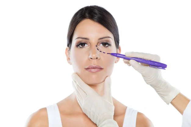plastic-surgeon-drawing-dashed-lines-on-her-patient-s-face_1301-7533.jpg