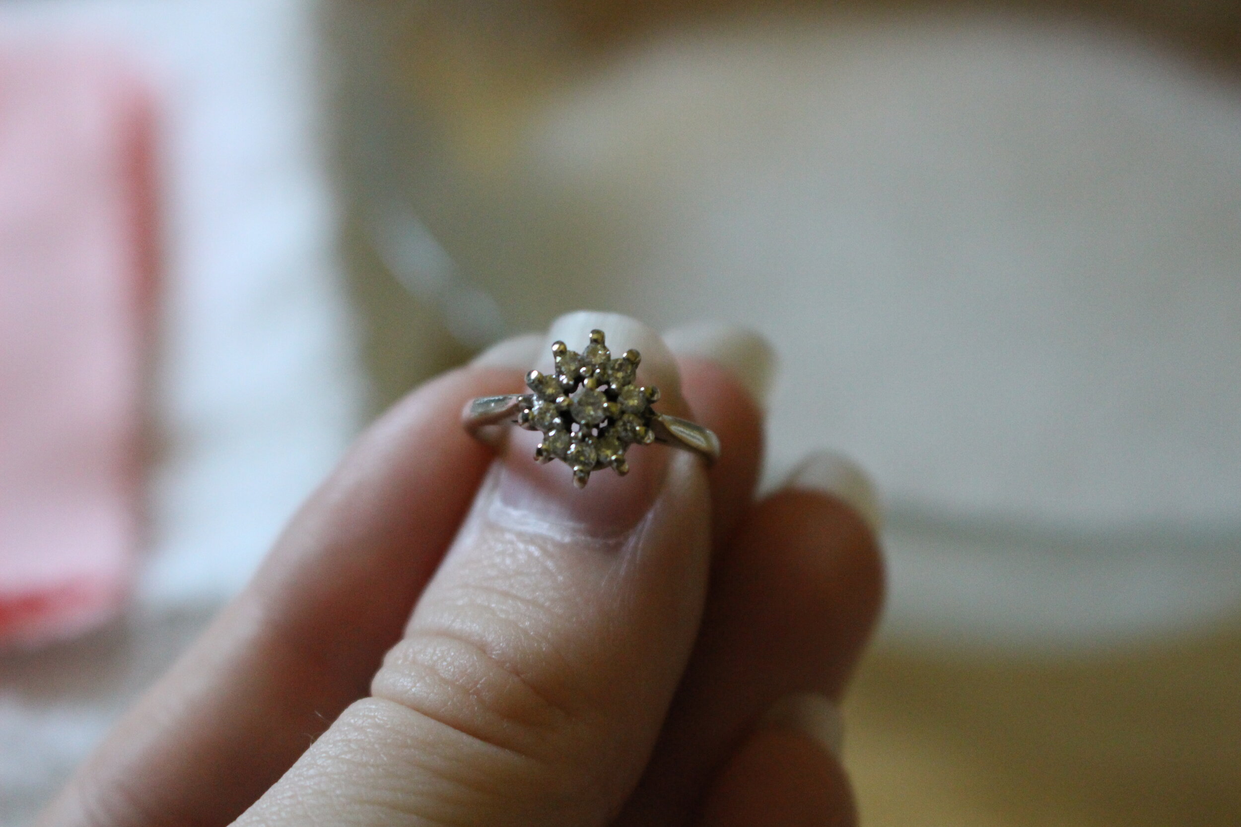 A white gold diamond cluster ring