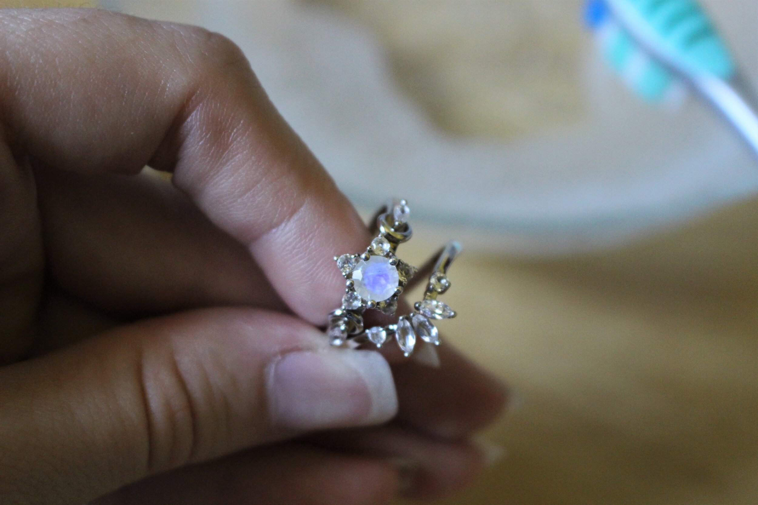  This sterling silver ring has a moonstone in it and will require a gentler touch than something like a sapphire or diamond. 