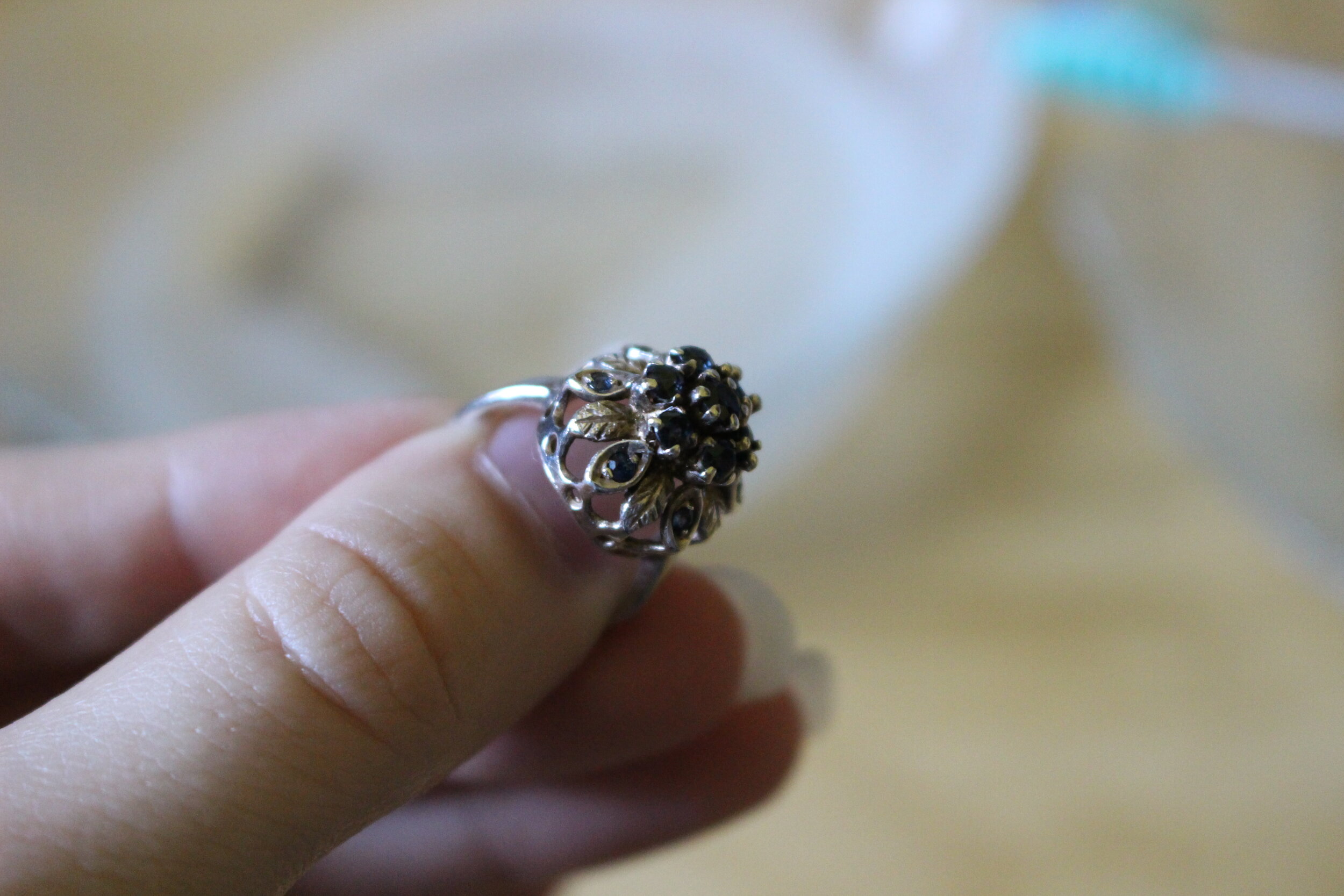 A silver ring with sapphires