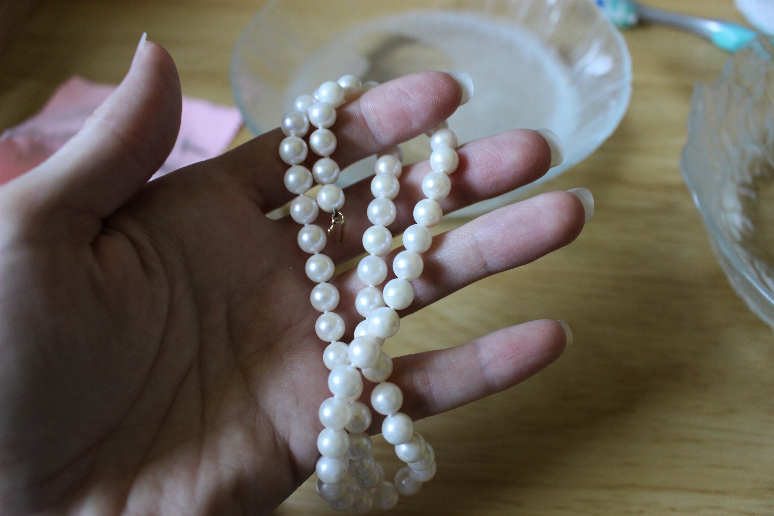 A basic strand of pearls, knotted with silk thread. 