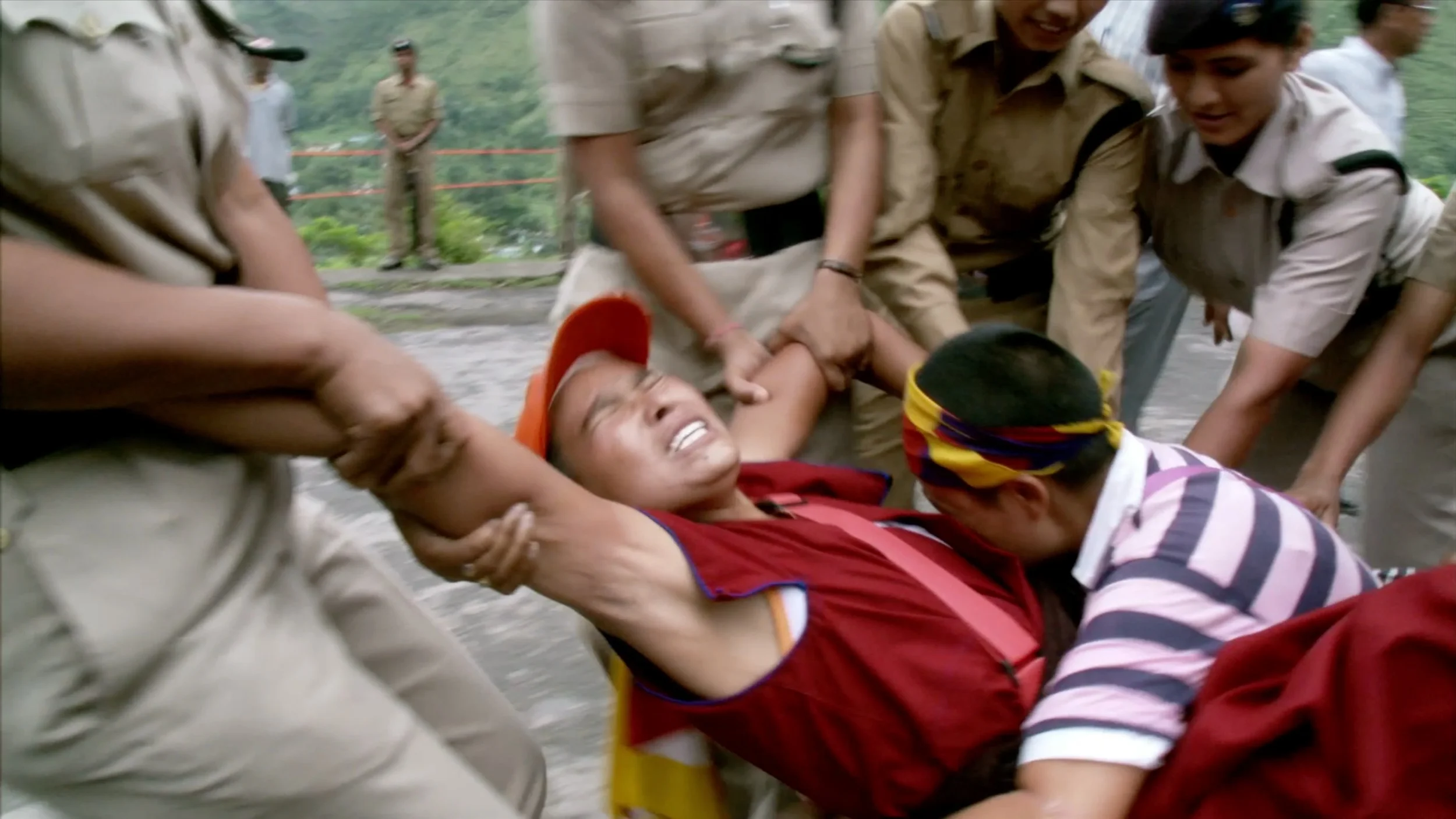 The Sun behind the Clouds Tenzing Sonam, Ritu Sarin | 2009 | UK, India | Documentary | 79' | English, Tibetan with English subtitles Screenplay: Tenzing Sonam Actors: Dalai Lama, Tenzin Tsundue, and others. Trailer The Tibetan-Indian pair of filmmakers Tenzin Sonam and Ritu Sarin had the privilege of accompanying the Dalai Lama during an eventful year for their film project. In 2008, in the run-up to the Beijing Olympics, there were fierce protests inside and outside Tibet, to which the world reacted with great interest and support. The Chinese government responded with the interruption of the Sino-Tibetan dialogue. Against this background, the film explores the interplay of personal and historical, spirituality and politics, and the tension between the Dalai Lama's efforts to find a peaceful solution and the impatience of a younger generation of Tibetans advocating a confrontational course.