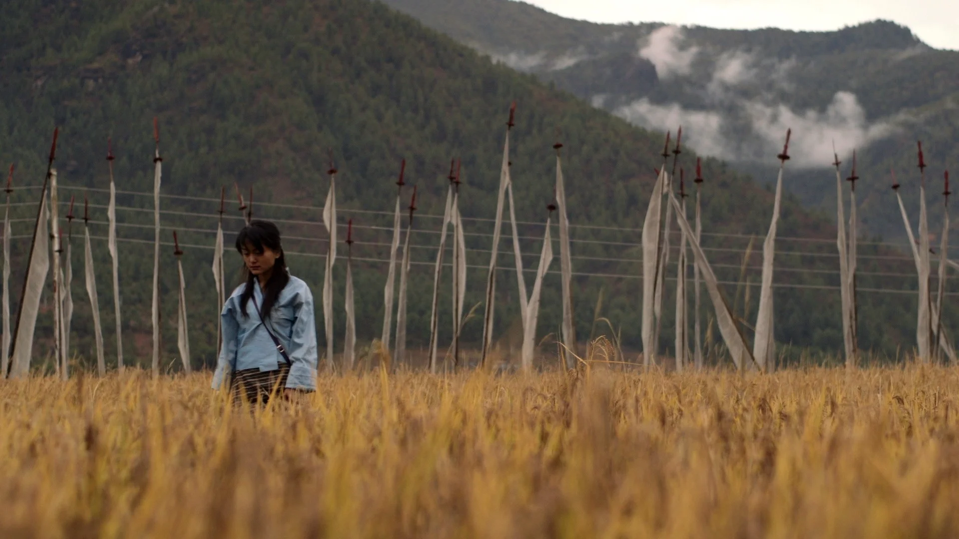 Lo Sum Choe Sum Dechen Roder | 2015 | Bhutan | Drama | 20' | Dzongkha with English Subtitles Screenplay: Dechen Roder Actor: Dechen Zangmo, and others. WATCH THE TRAILER The traditional “3 Year, 3 Month Retreat” or “Lo-Sum-Choe-Sum” is practiced by Buddhist monks, nuns and other devout practitioners. 3 years, 3 months, and 3 days is calculated as the time needed to achieve a higher state of clarity and motivation. By cutting oneself off from the world, and delving into the inner mind, the retreat is supposed to transform the practitioner. Can Lhamo, a young, wounded girl facing the harsh gaze of the world, find her own form of retreat and redemption?
