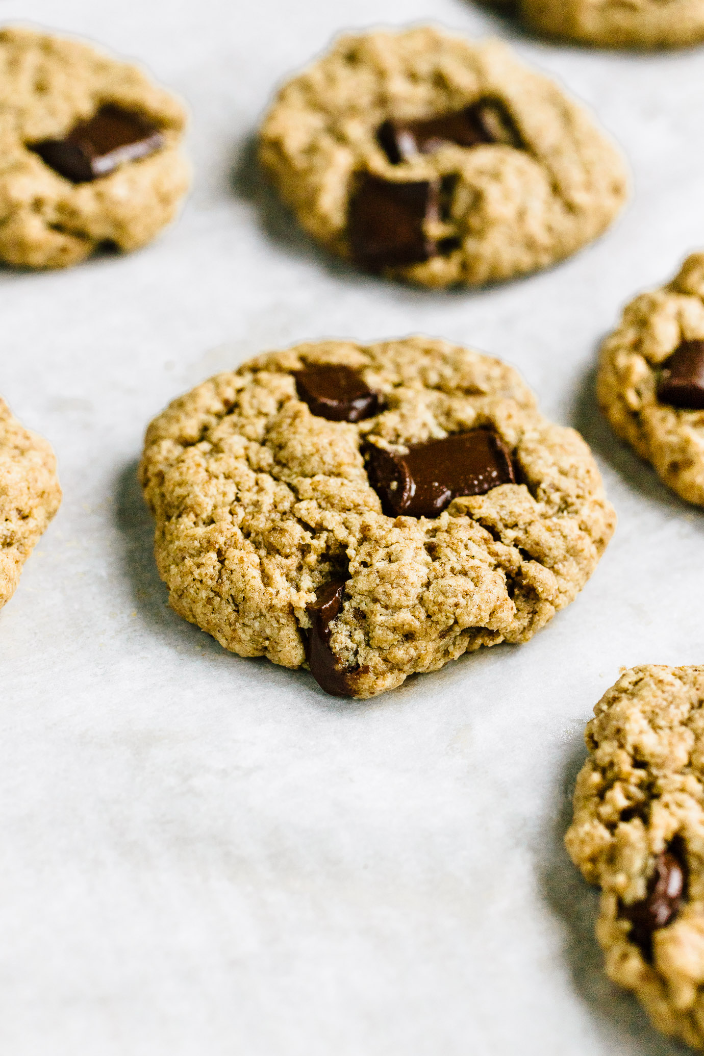 chocolate chip tahini cookies on parchment paper